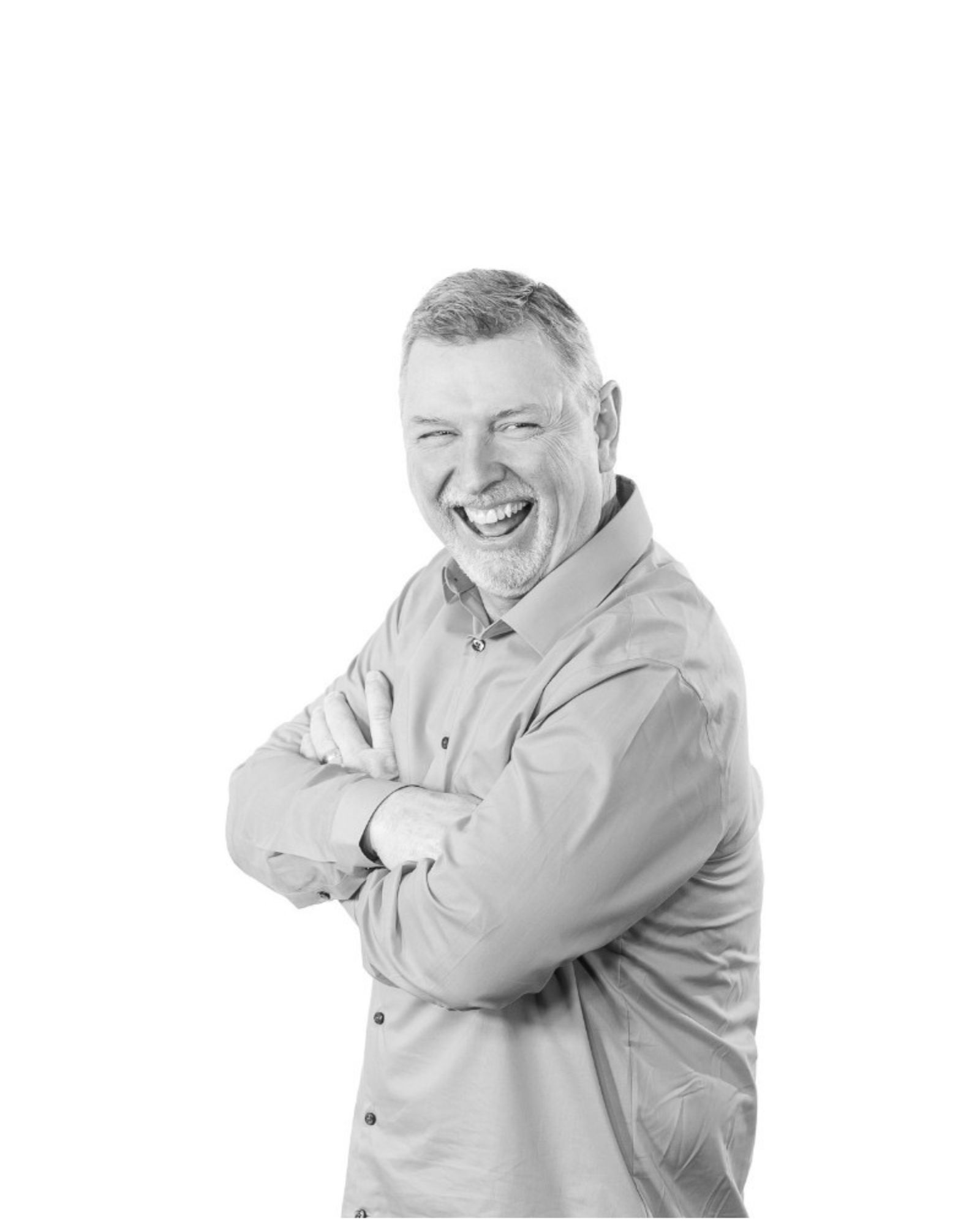 eddie speed note investing legend smiling while crossing his arms